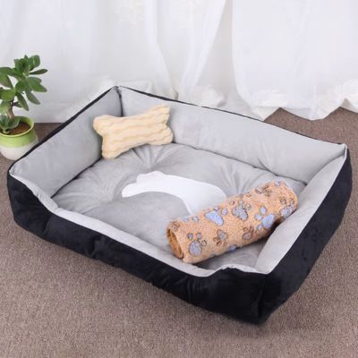 couchage-chien-noir-avec-couverture-anti-stress